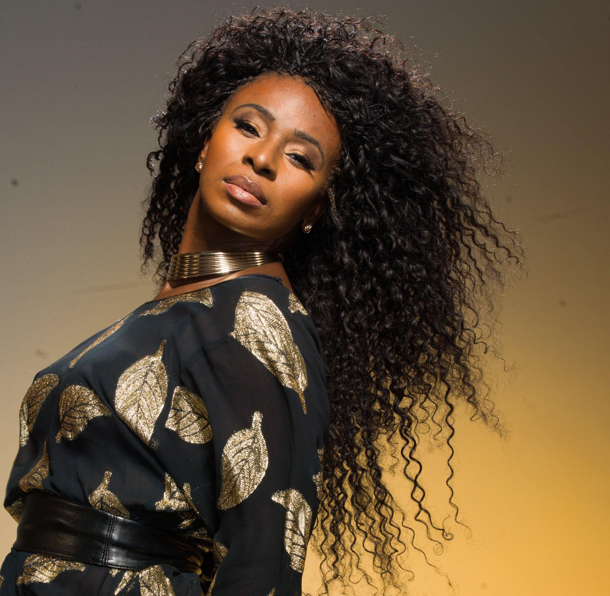 Mushiya wearing 5 bundles of Skarlette Rouge on a weft from Runway Curls Natural Hair Extensions Line, Classic Collection