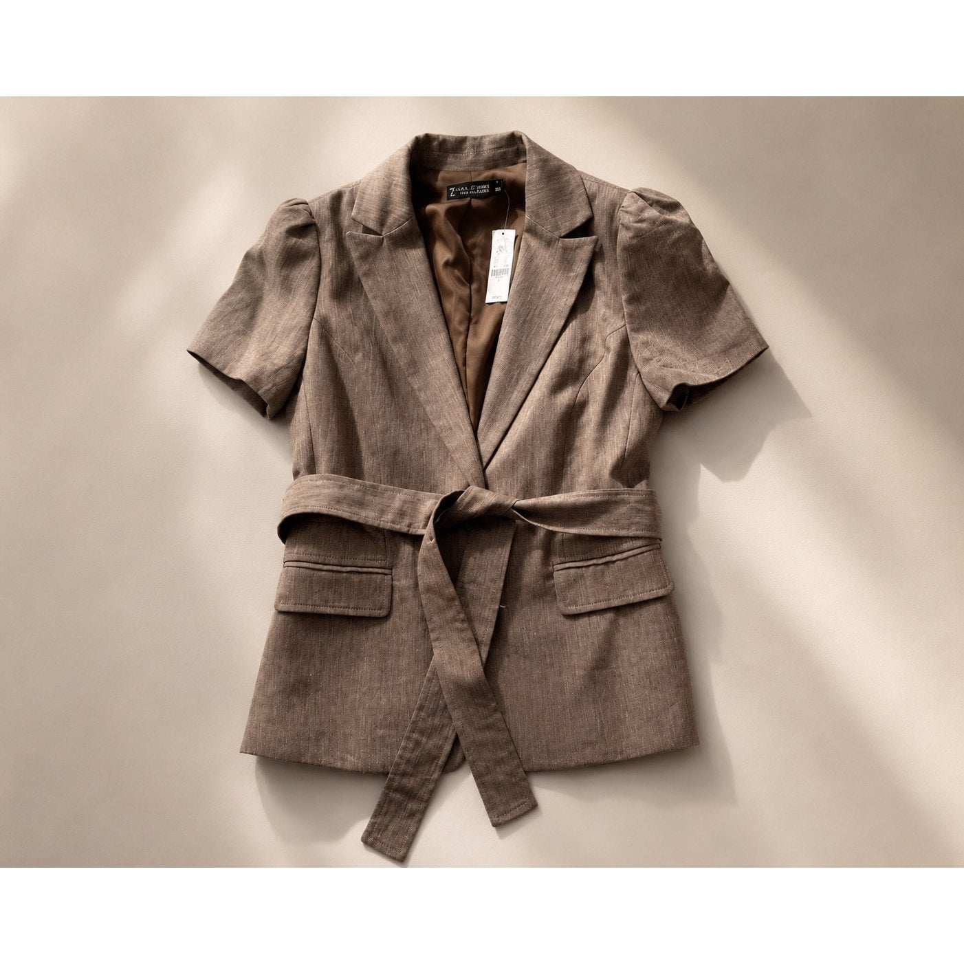 Woman’s brown 2 piece suit size 8 top and small bottom