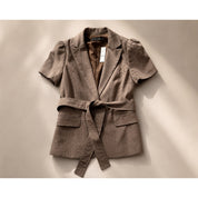 Woman’s brown 2 piece suit size 8 top and small bottom