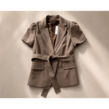 Woman’s brown 2 piece suit size 8 top and small bottom